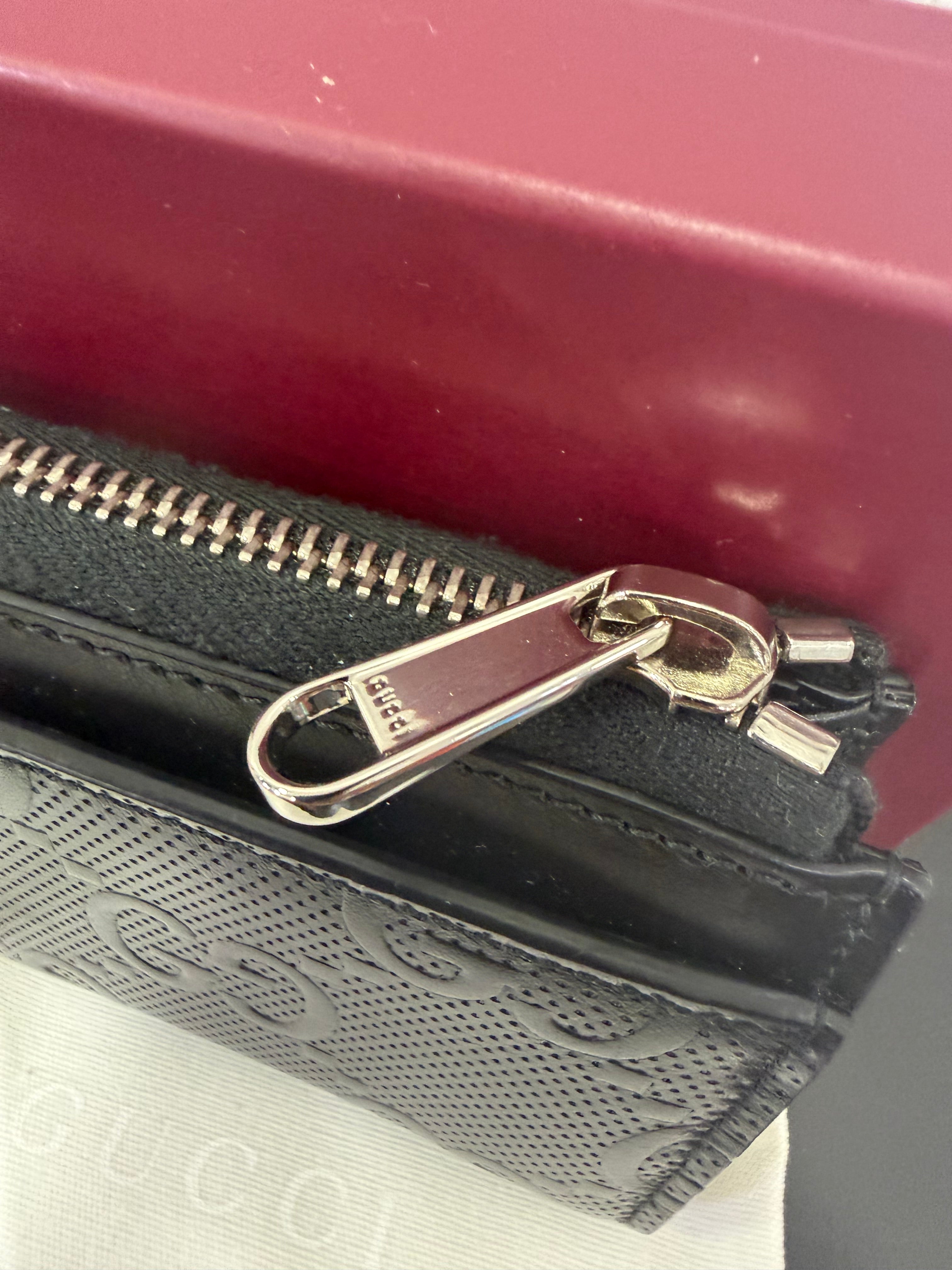 Gucci Portamonete in pelle GG