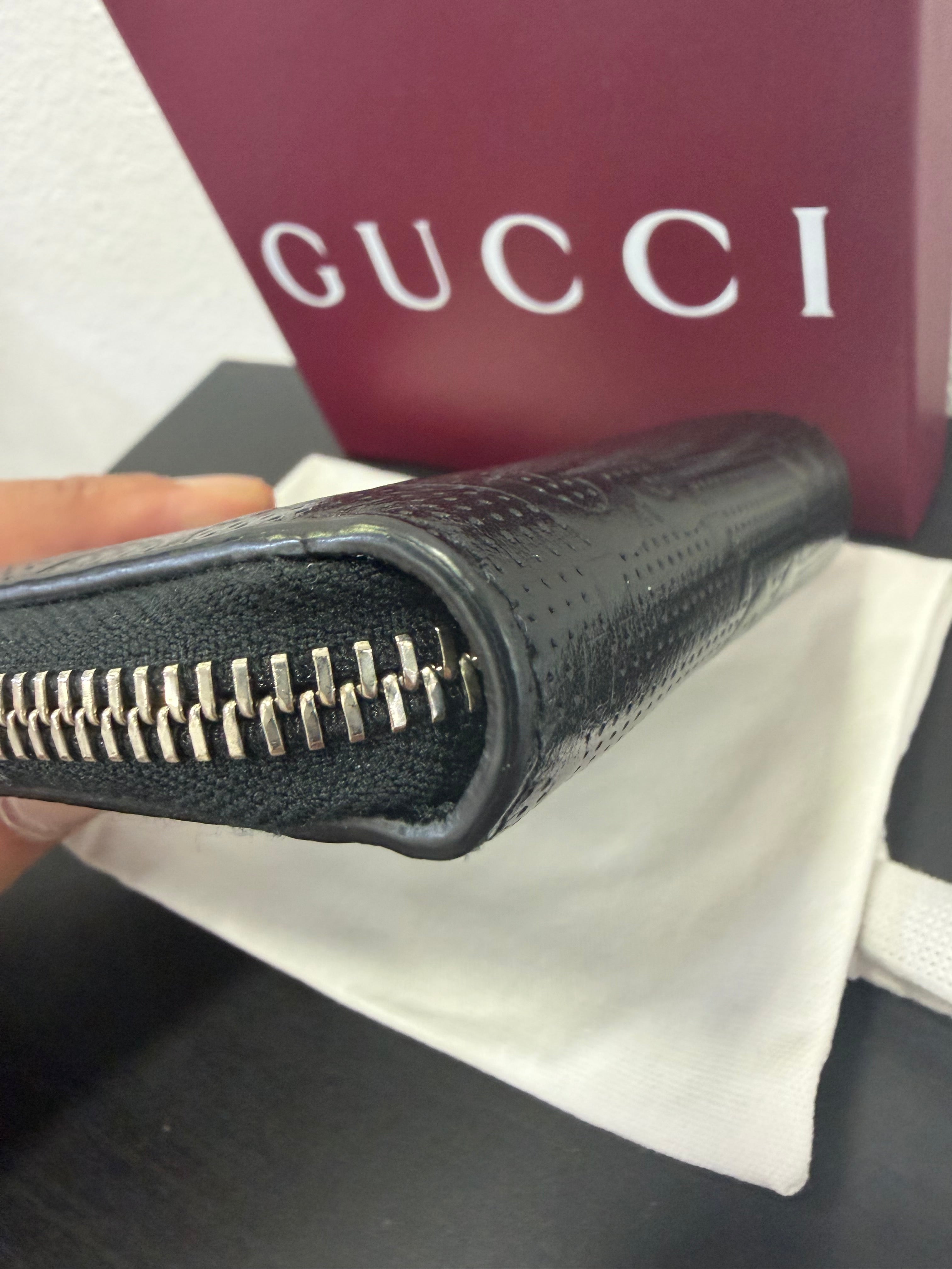 Gucci Portamonete in pelle GG
