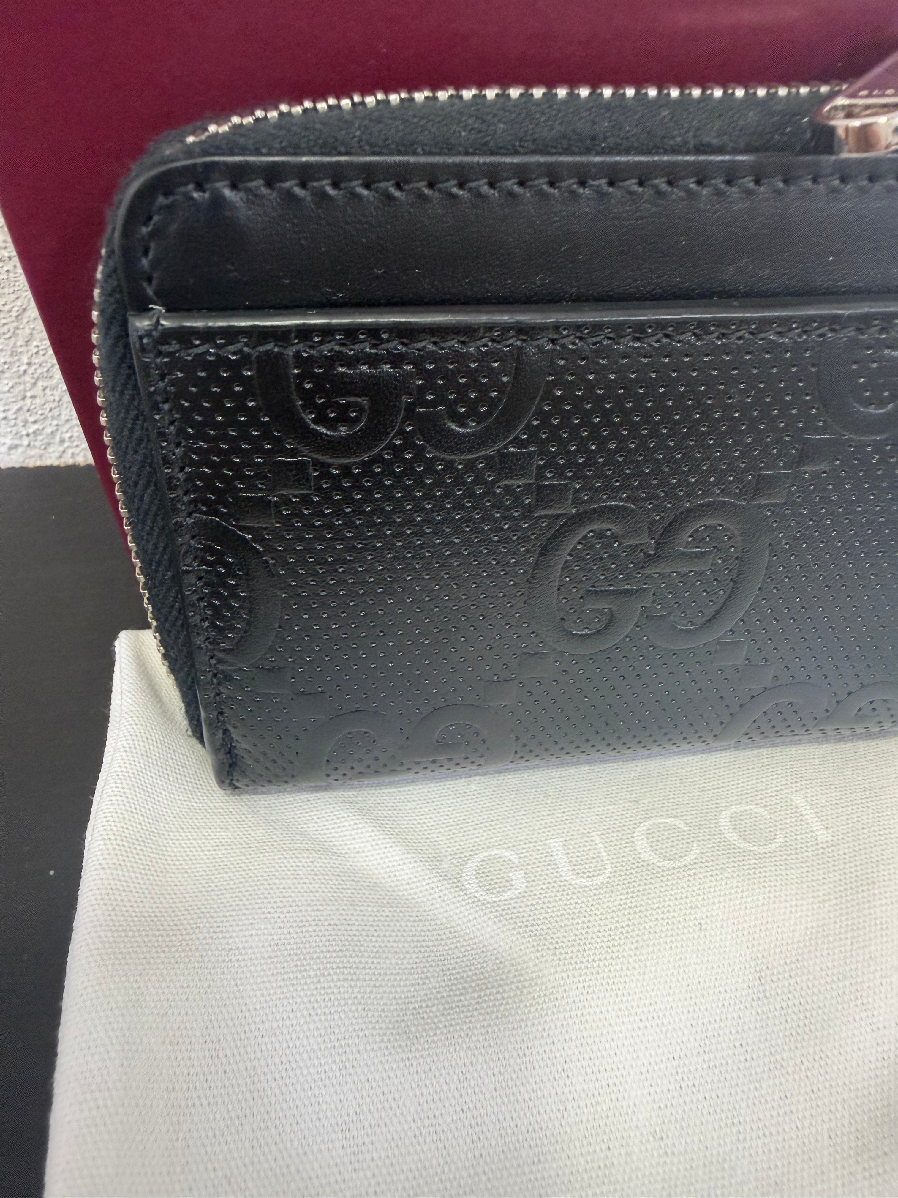 Gucci Portamonete in pelle GG