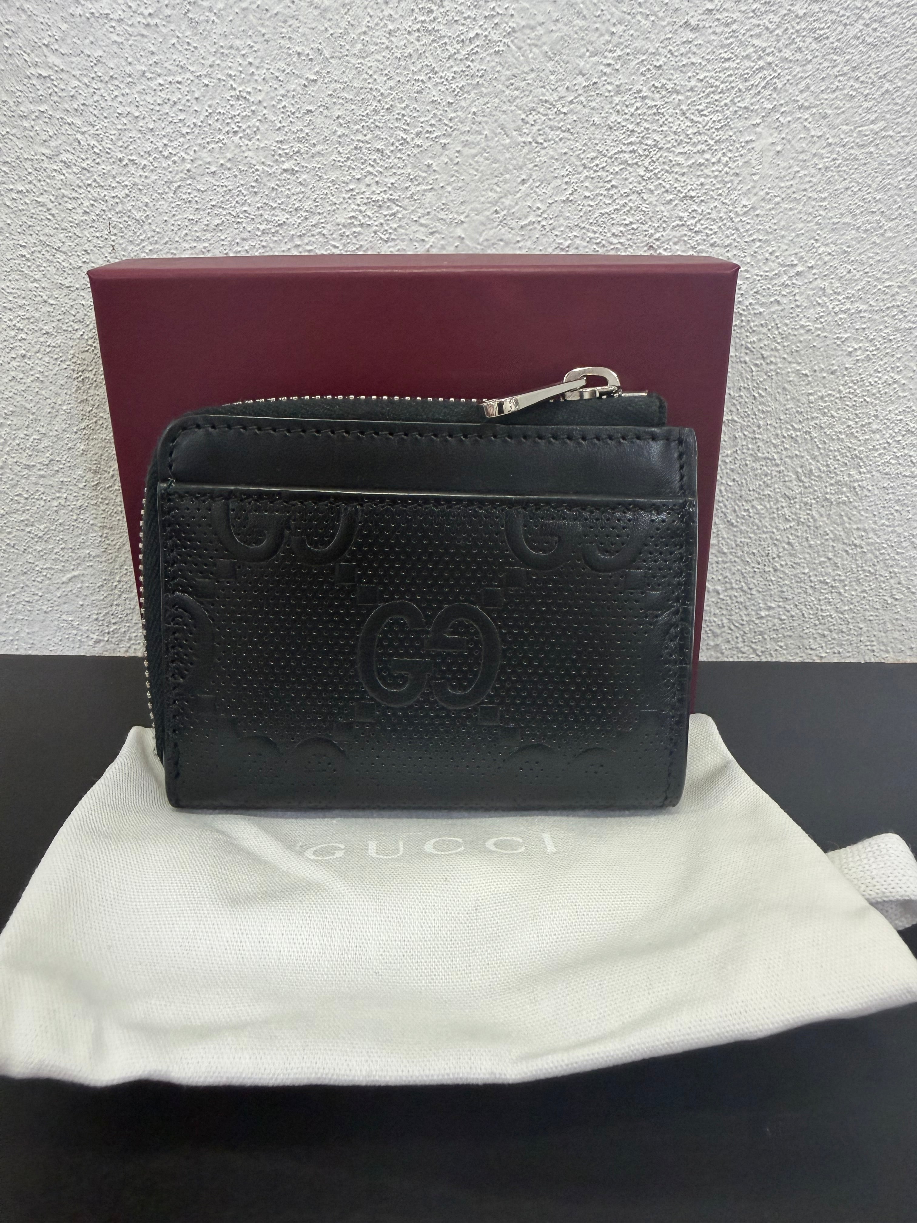 Gucci Portamonete in pelle GG